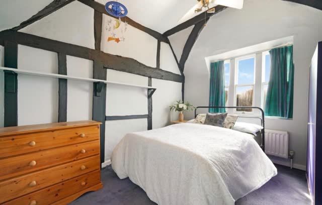 Bedroom with exposed beams