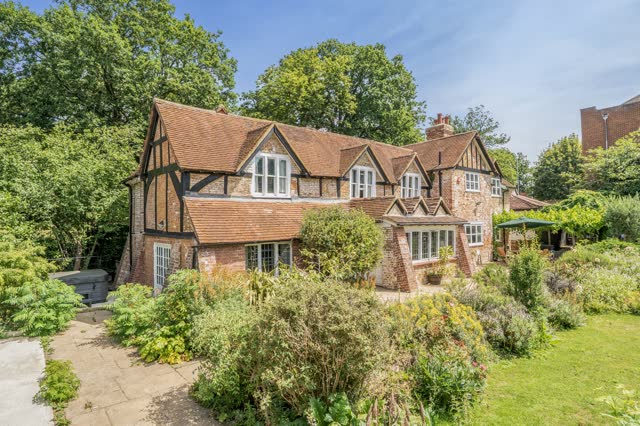 Grade II listed red-brick facade in summer